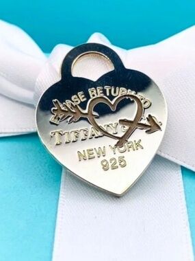 Tiffany and Company Return to Tiffany etched heart & arrow heart charm 925
